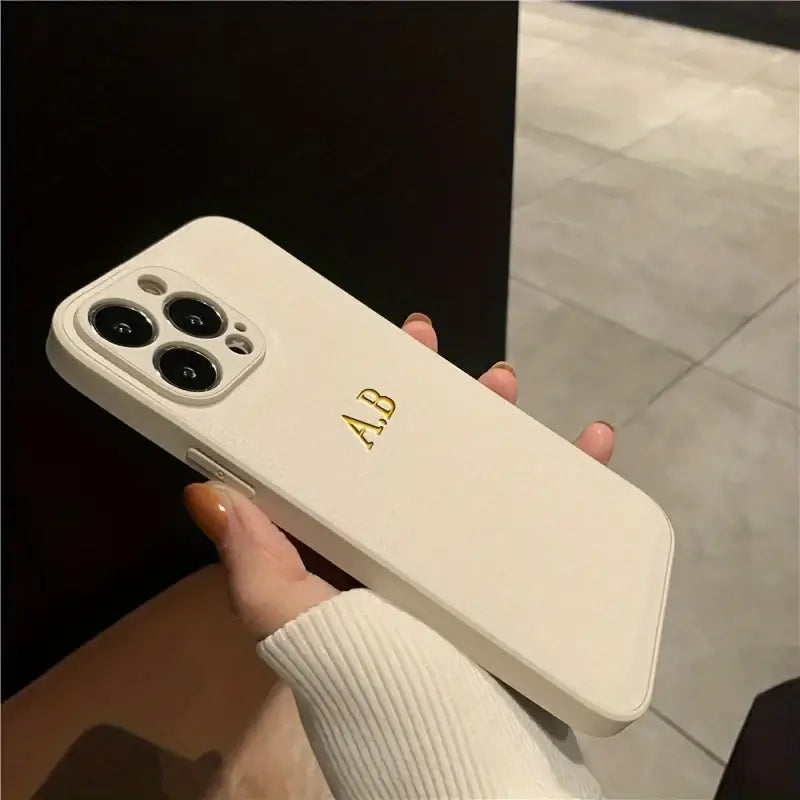 Personalized white leather iPhone case with initials A.B. for iPhone 12 13 14 15 16 Pro Max models.