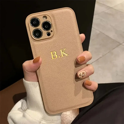 tan phone case with etching.